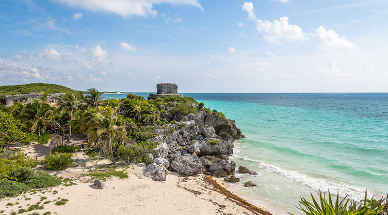 Caribbean beach with Mayan Ruins of Tulum on background - Tulum, Mexico